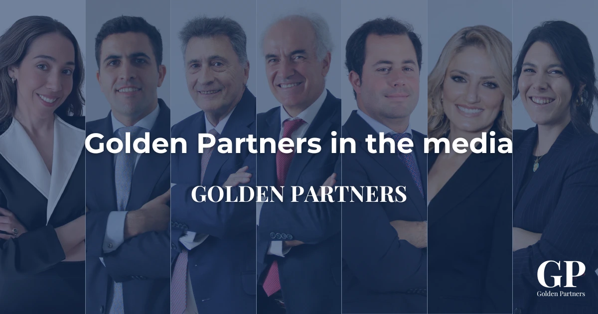 he Golden Partners team of lawyers smiling in business attire.